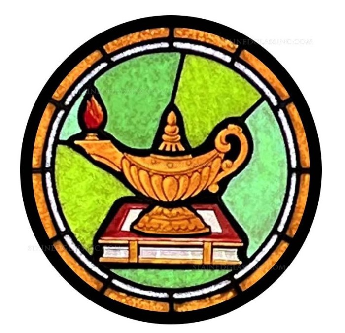An image of a round, stained-glass window with the lamp of knowledge burning on top of a book.